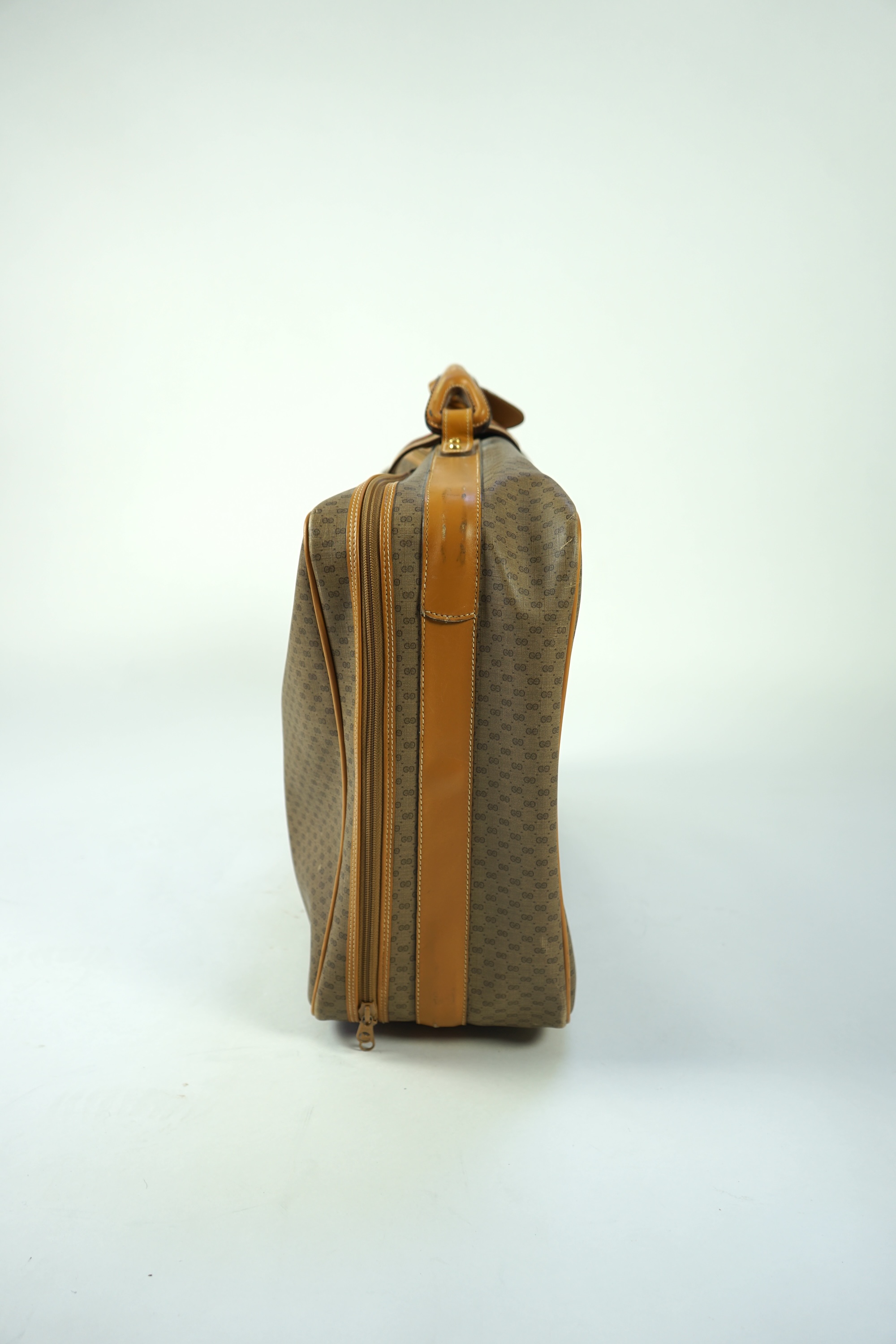 A vintage Gucci micro GG monogram canvas suitcase